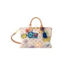 Beige Louis Vuitton Speedy Soft 30 Flight Mode handbag with colorful travel patches