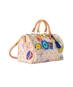 Monogram Dune Speedy Soft 30 bag with gold airplane charm and leather trim