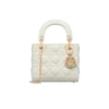 Shiny white Lady Dior bag with gold hardware and signature quilted pattern