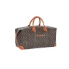 Brown Goyard travel bag with calfskin leather corners