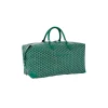 Green Goyard travel bag with yellow interior lining