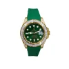 Luxury green Rolex Submariner-style watch with diamond bezel and green rubber strap on wrist