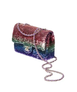 Side view of Chanel small flap bag in multicolor sequins showing slim structure, gold-tone chain strap, and compact mini rectangular design with luxury finish