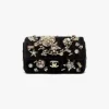 Chanel mini classic handbag in black velvet with strass, imitation pearls, and gold-tone metal luxury finish