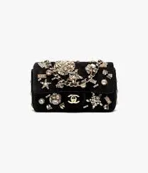 Chanel mini classic handbag in black velvet with strass, imitation pearls, and gold-tone metal luxury finish