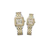 Professional shot of two-tone gold and silver luxury watches featuring a diamond dial and Roman numerals.