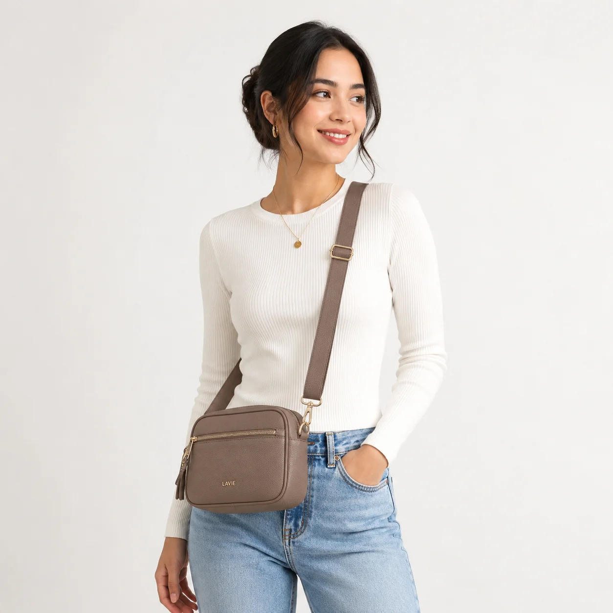 Luxury designer crossbody bag, structured, gold hardware, white background, product photography, premium fashion
