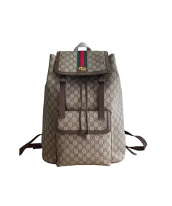 Beige Gucci Ophidia designer backpack featuring black leather trim and gold-tone hardware